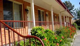 The verandah along the motel units with garden beds