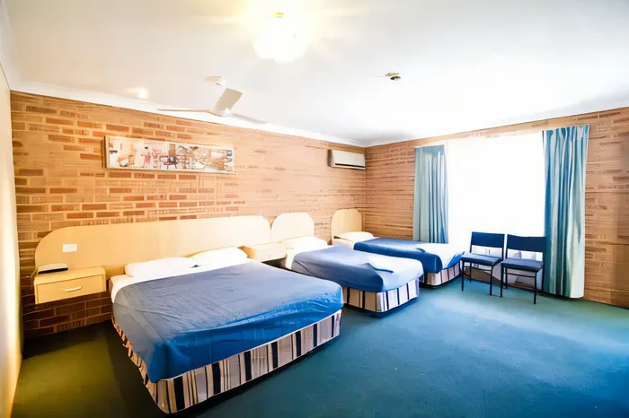 Family room with a queen bed and two single beds