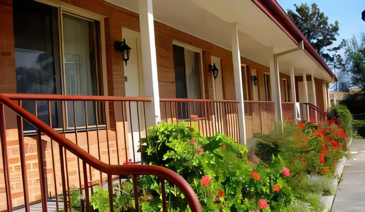 The covered verandah running along the ground-floor units