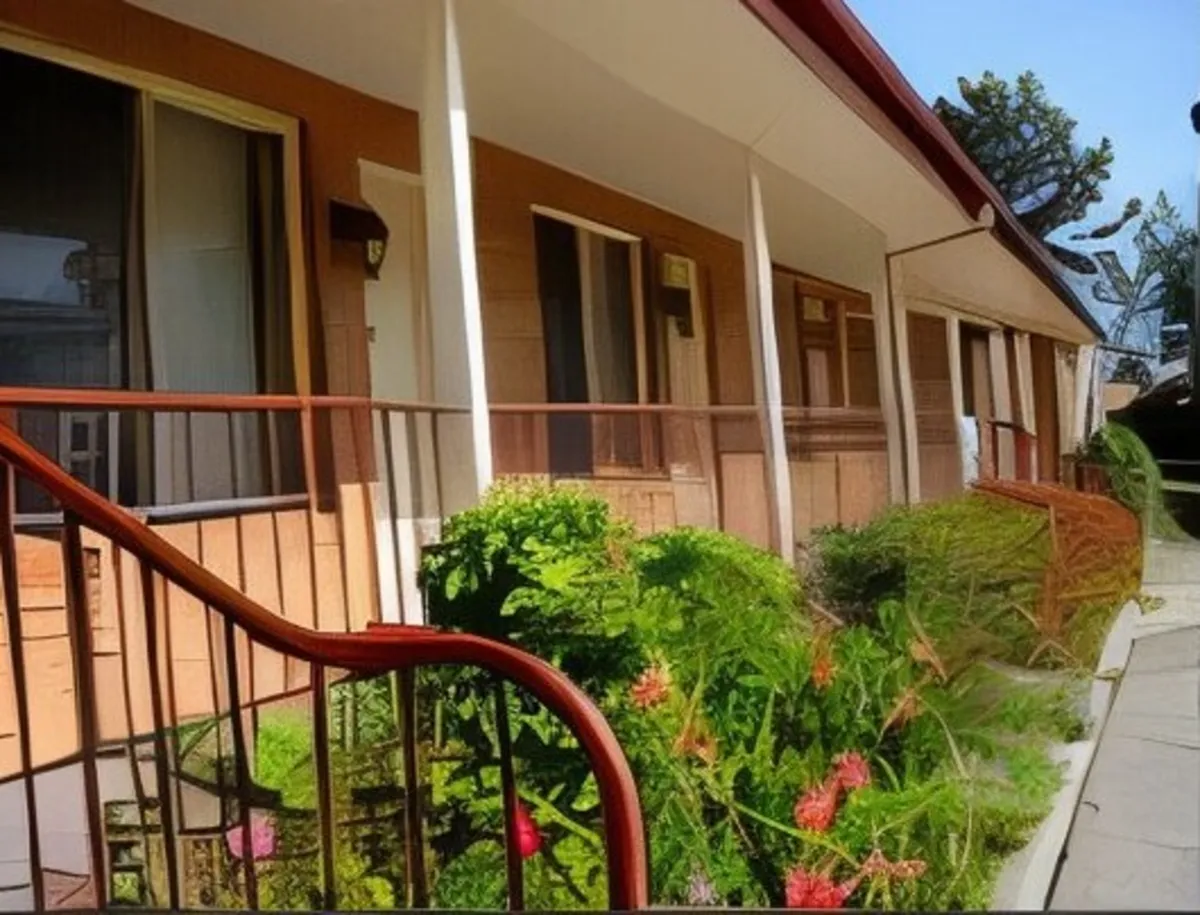 Flowering garden beds along the verandah outside the units