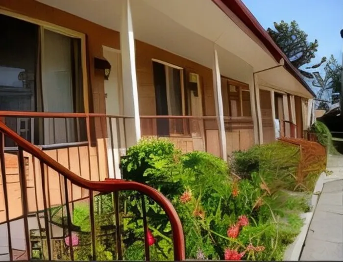 Flowering garden beds along the verandah outside the units