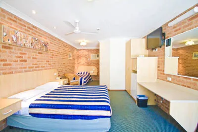 A motel room with twin beds
